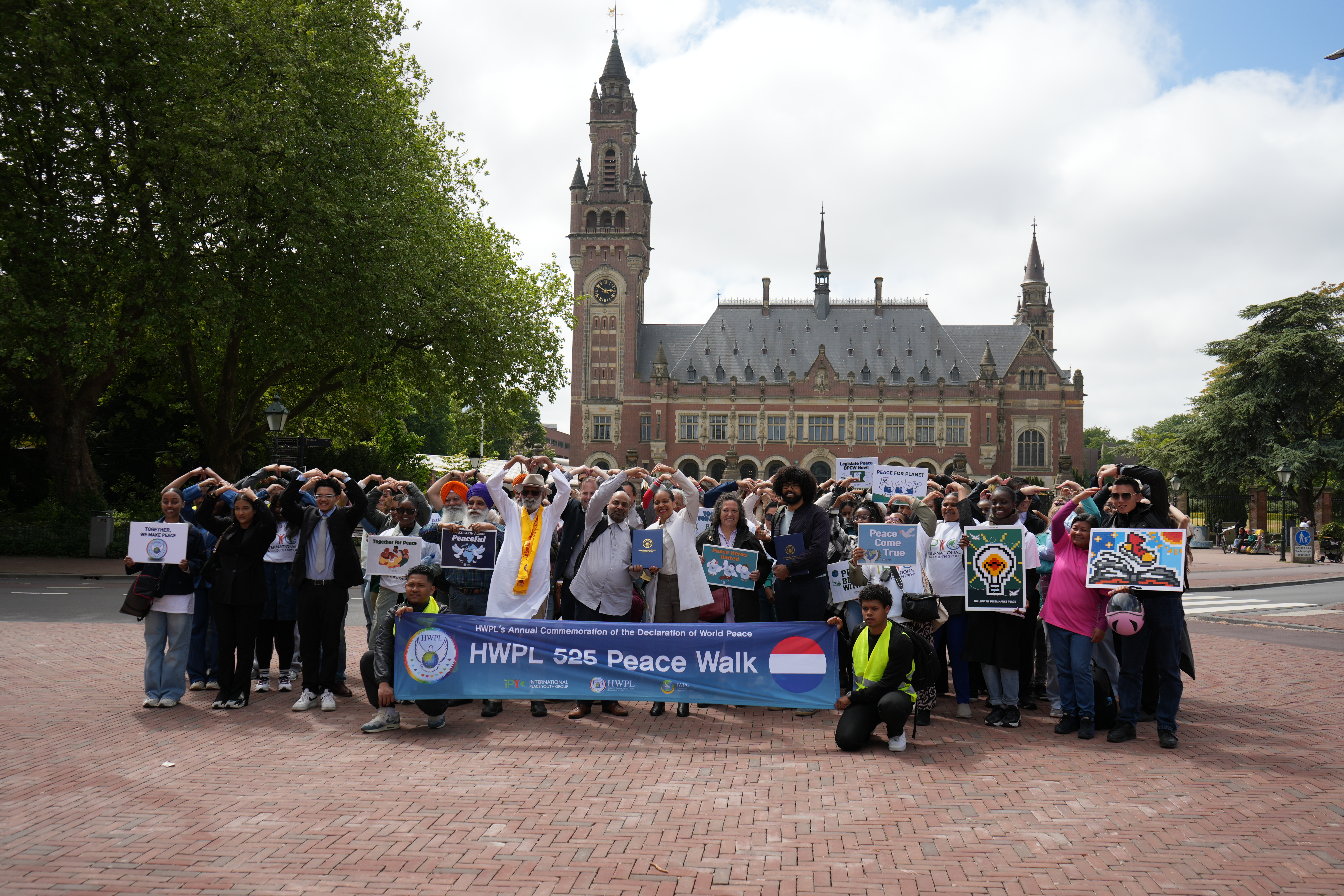 2025 Peace Walk with Paint For Peace Canvases (in front of Peace Palace)